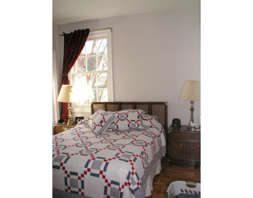 21 Harris Street, Unit 2 Somerville, MA 02140 - Photo 11 of 13 a bedroom with a bed and a window
