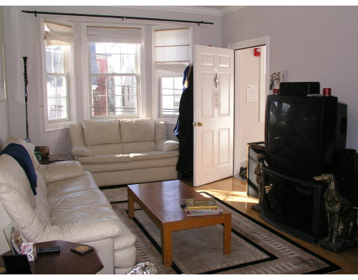 21 Harris Street, Unit 2 Somerville, MA 02140 - Photo 3 of 13 a living room with furniture and a flat screen tv