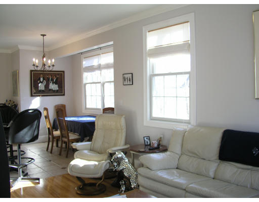 21 Harris Street, Unit 2 Somerville, MA 02140 - Photo 4 of 13 a living room with furniture a dining table and a window