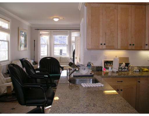 21 Harris Street, Unit 2 Somerville, MA 02140 - Photo 5 of 13 a living room with furniture a rug and a window
