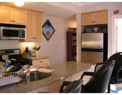 21 Harris Street, Unit 2 Somerville, MA 02140 - Photo 6 of 13 a kitchen with granite countertop a refrigerator and a sink
