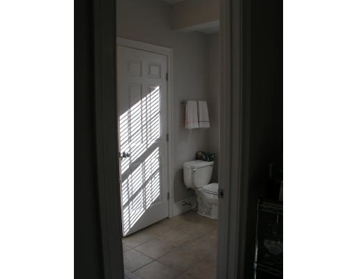 21 Harris Street, Unit 2 Somerville, MA 02140 - Photo 9 of 13 a bathroom with a toilet and a sink