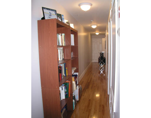 21 Harris Street, Unit 2 Somerville, MA 02140 - Photo 10 of 13 a view of a hallway with windows