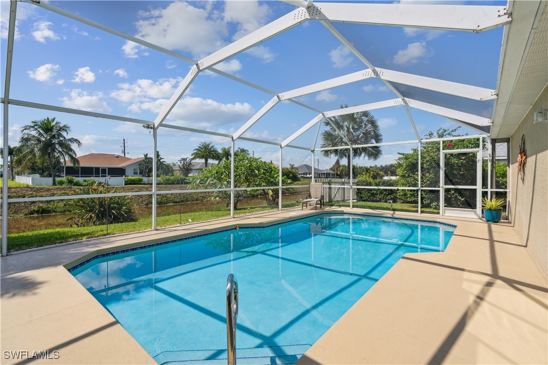 4644 Varsity Circle Lehigh Acres, FL 33971 - Photo 23 of 29 a view of a backyard with a swimming pool