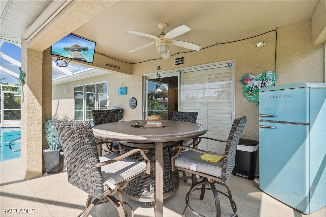 4644 Varsity Circle Lehigh Acres, FL 33971 - Photo 25 of 29 a view of a dining room with furniture and wooden floor