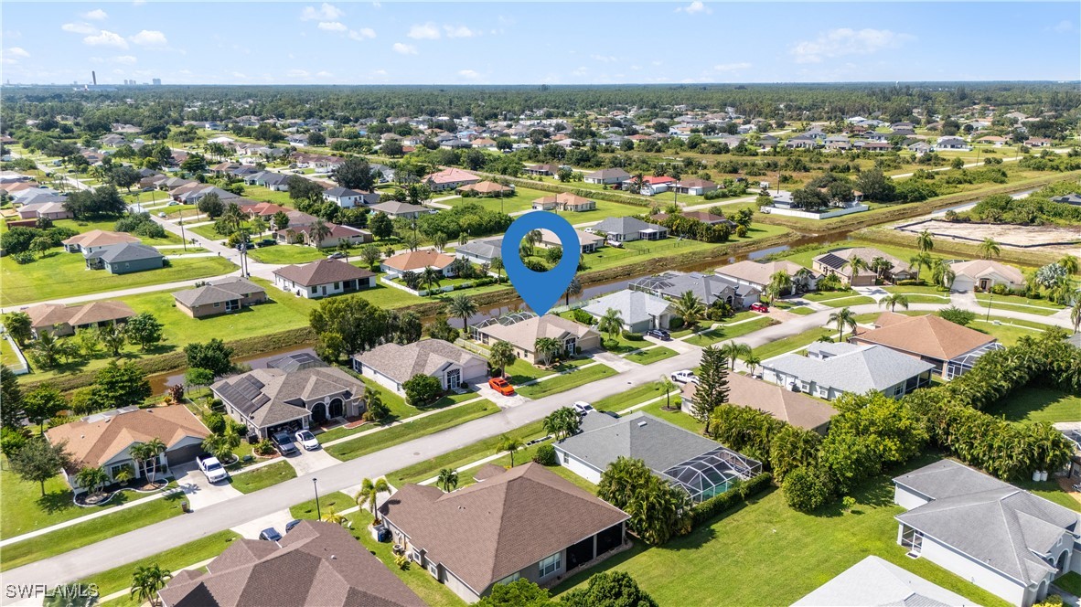 4644 Varsity Circle Lehigh Acres, FL 33971 - Photo 3 of 29 an aerial view of residential houses with outdoor space