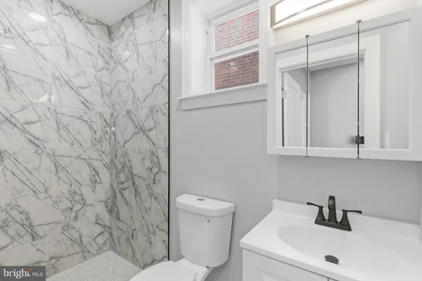 a bathroom with a sink and a toilet