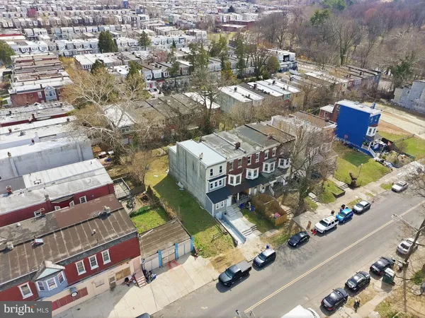 an aerial view of residential houses with outdoor space
