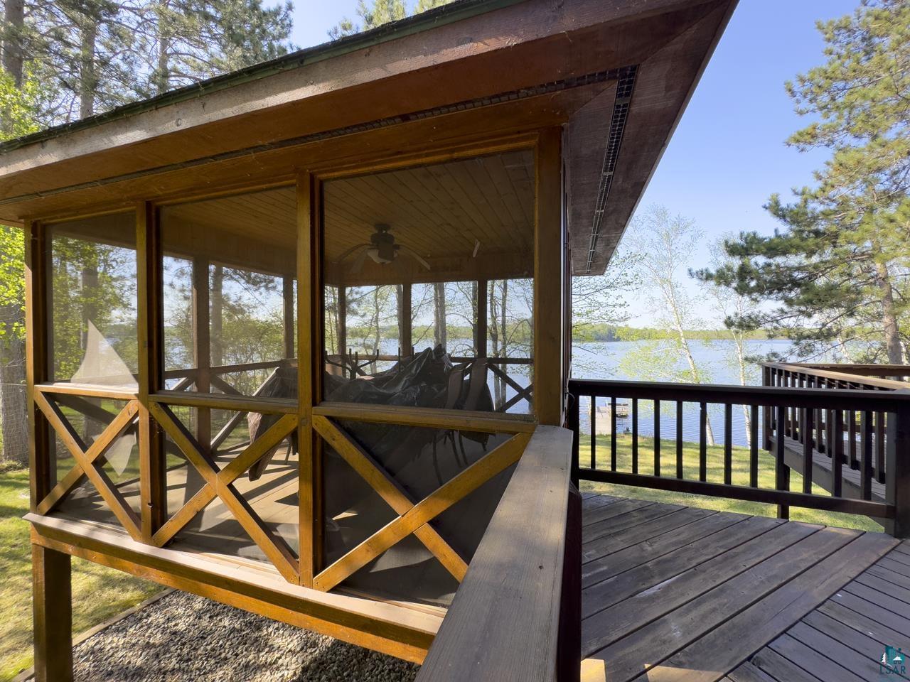 1880 Everett Bay Road Tower, MN 55790 - Photo 26 of 50 Wooden terrace featuring a water view and a sunroom