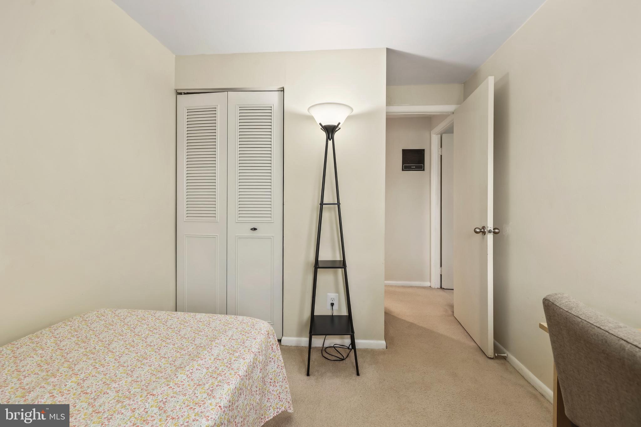 302 Giles Place Sterling, VA 20164 - Photo 11 of 23 a bedroom with a bed and a chandelier