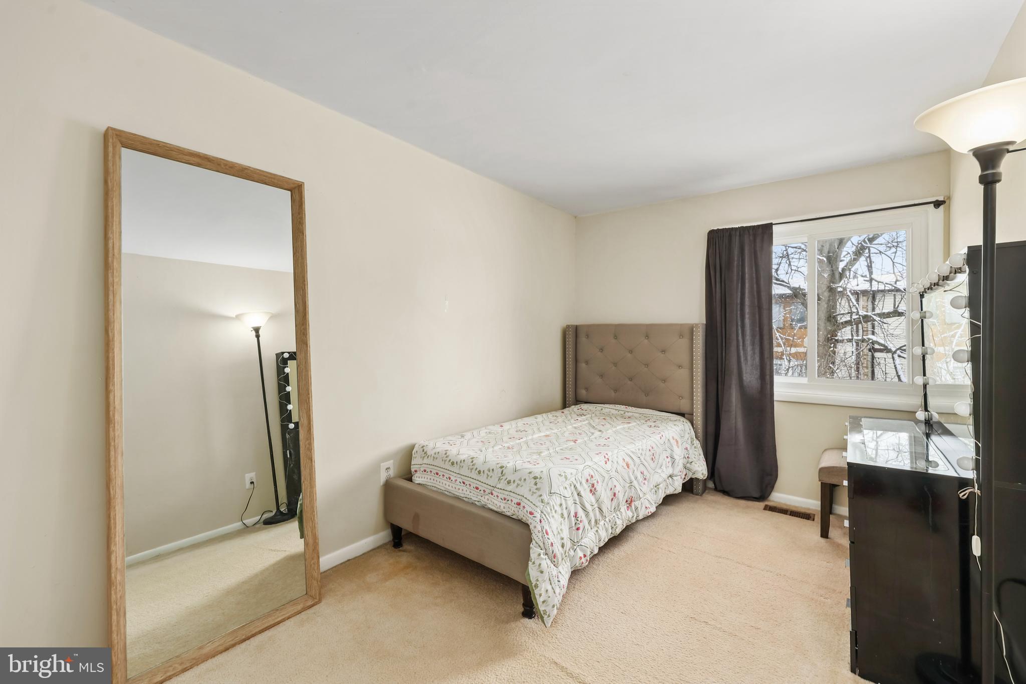 302 Giles Place Sterling, VA 20164 - Photo 12 of 23 a bedroom with a bed and wooden floor