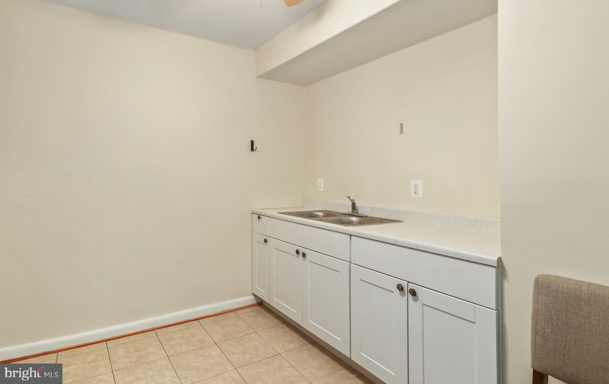 302 Giles Place Sterling, VA 20164 - Photo 14 of 23 a room with a sink and cabinets