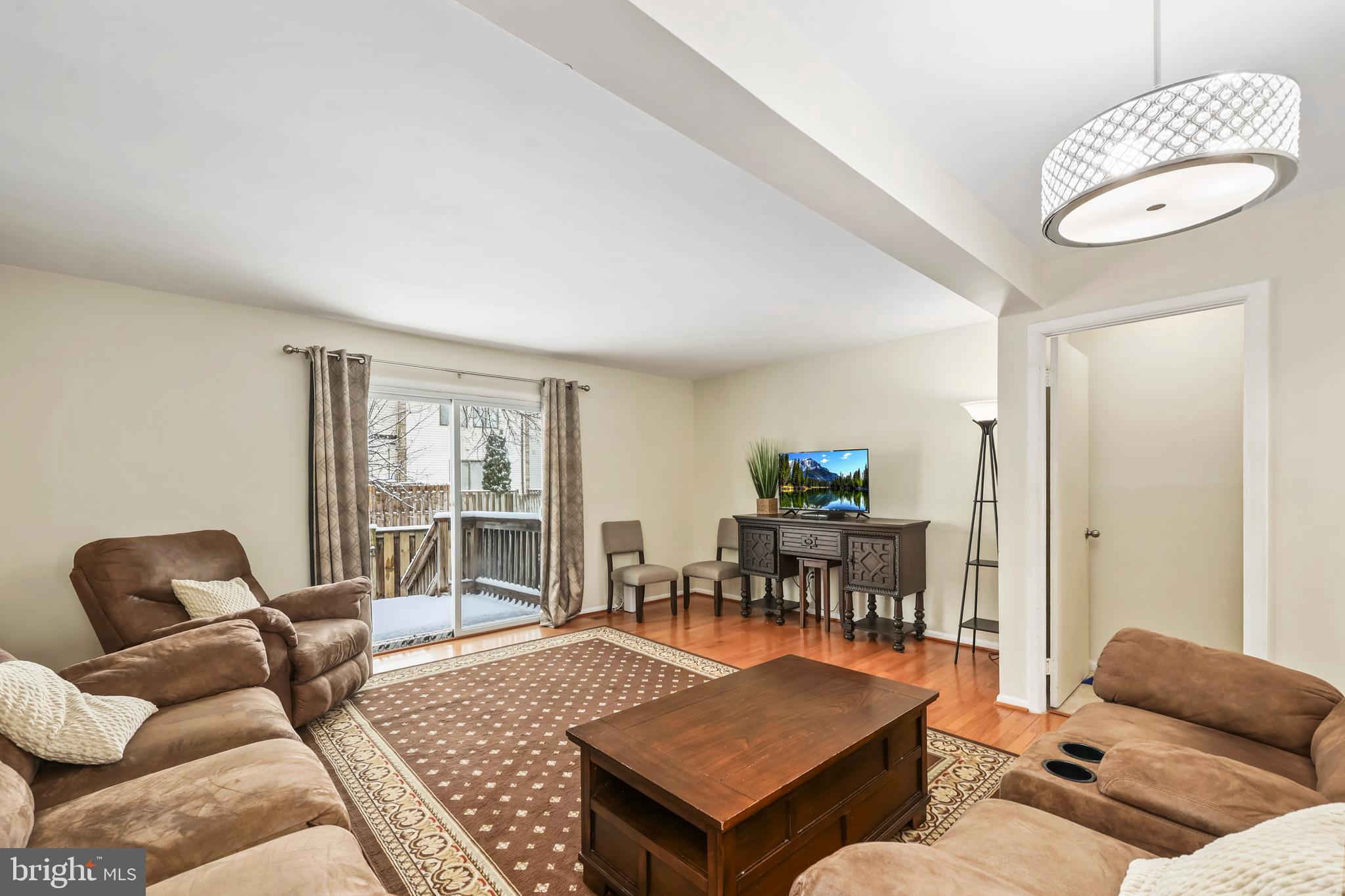 302 Giles Place Sterling, VA 20164 - Photo 20 of 23 a living room with furniture and a table