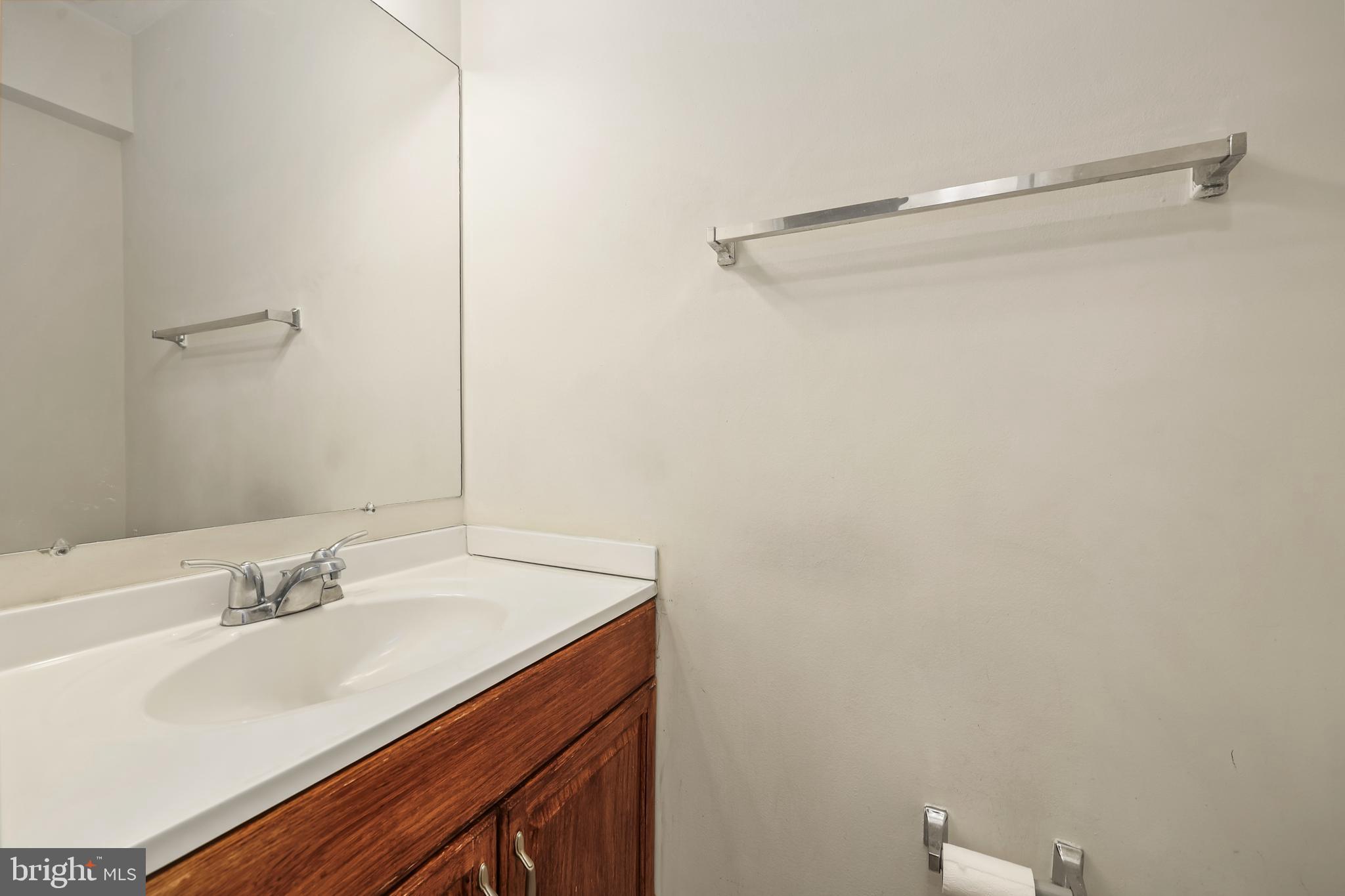 302 Giles Place Sterling, VA 20164 - Photo 5 of 23 a bathroom with a sink and a mirror