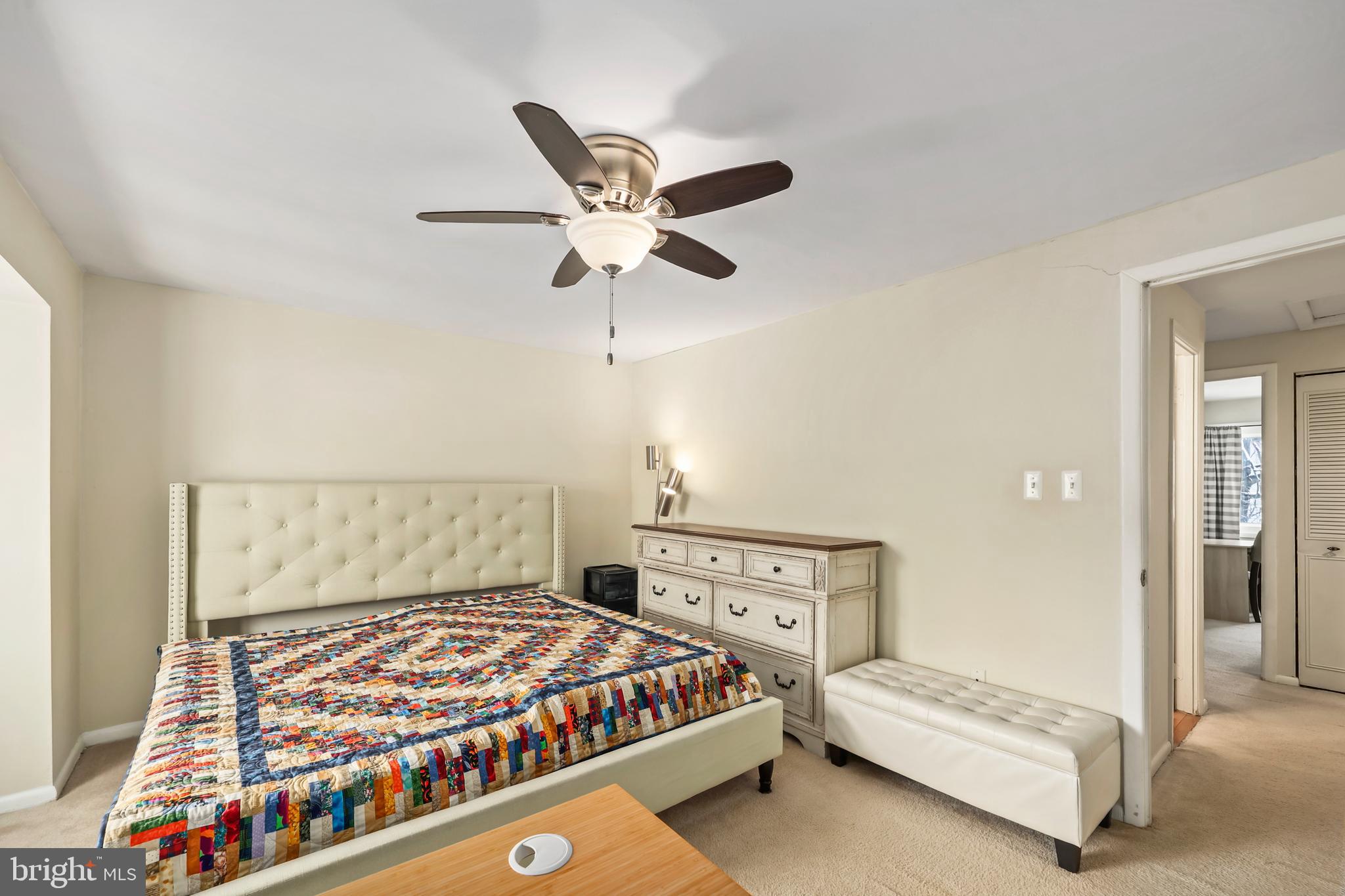 302 Giles Place Sterling, VA 20164 - Photo 7 of 23 a bedroom with a bed and a chandelier
