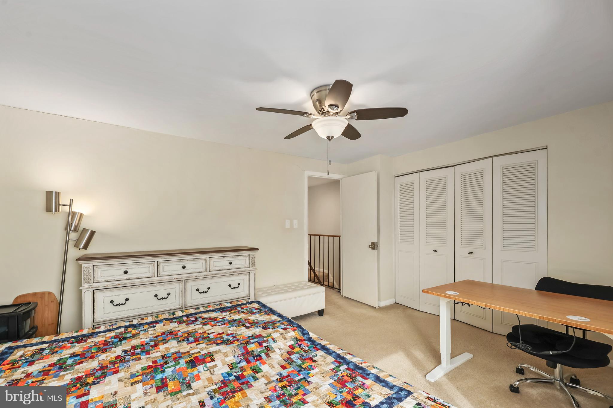 302 Giles Place Sterling, VA 20164 - Photo 8 of 23 a bedroom with a bed and a chandelier