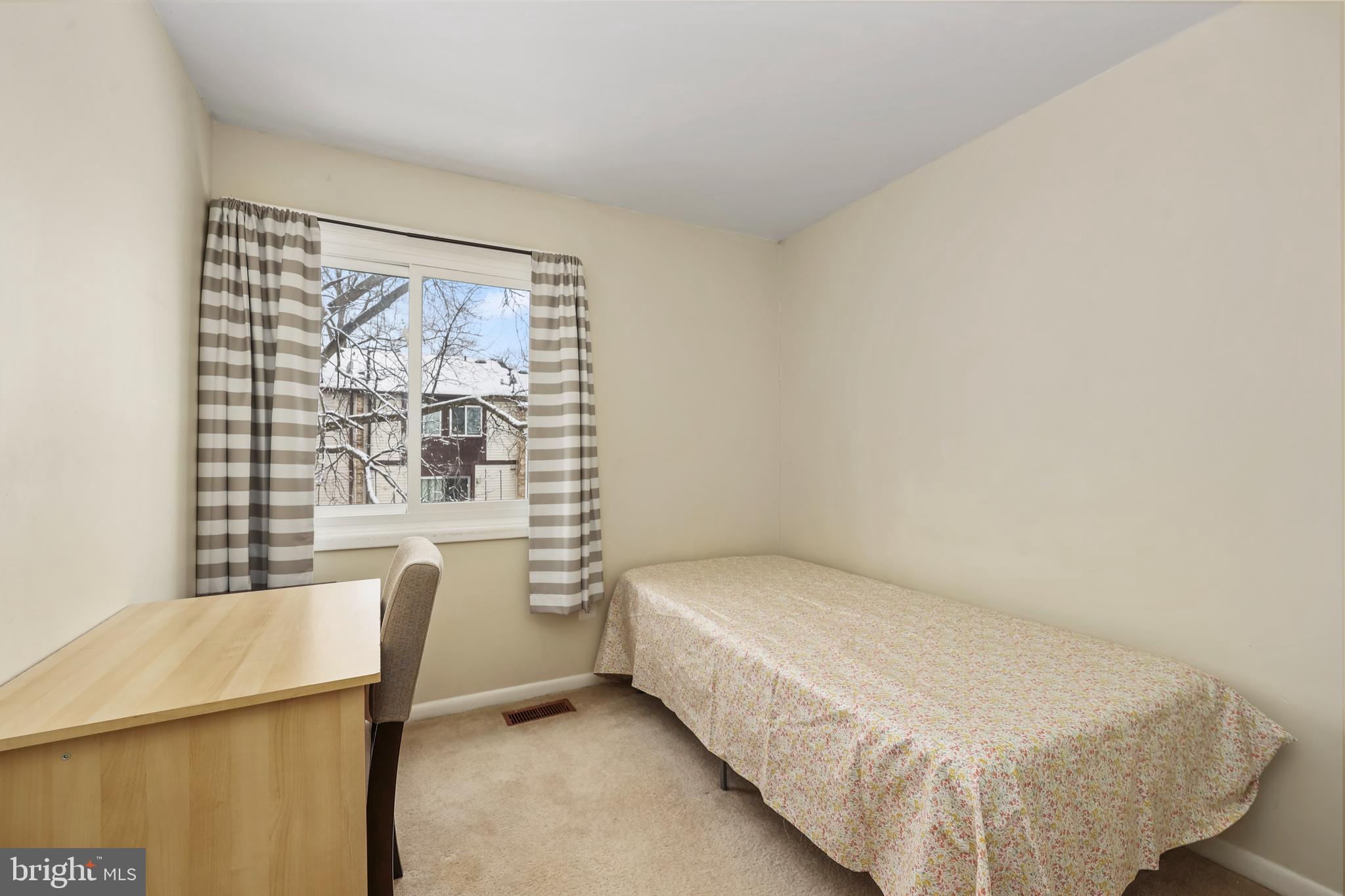 302 Giles Place Sterling, VA 20164 - Photo 10 of 23 a bedroom with a bed and a window