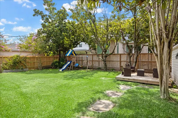 a backyard of a house with lots of green space