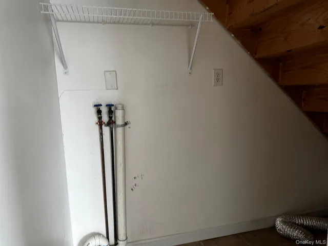 a view of a kitchen with a sink and a window