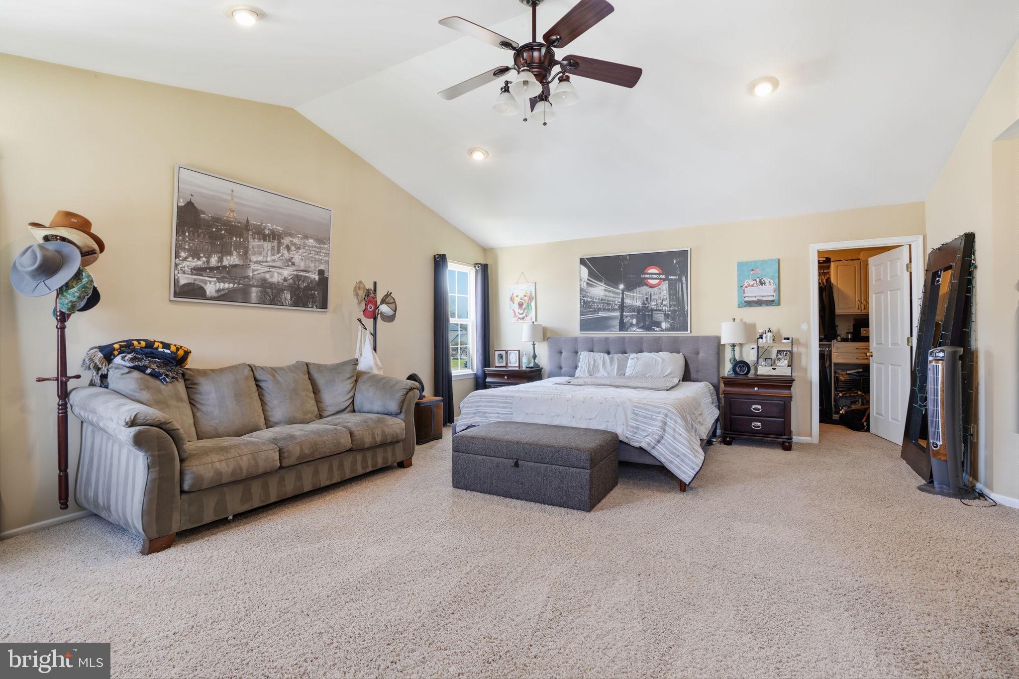 36 Moray Lane Sewell, NJ 08080 - Photo 16 of 40 a spacious bedroom with a bed a couch and a chandelier