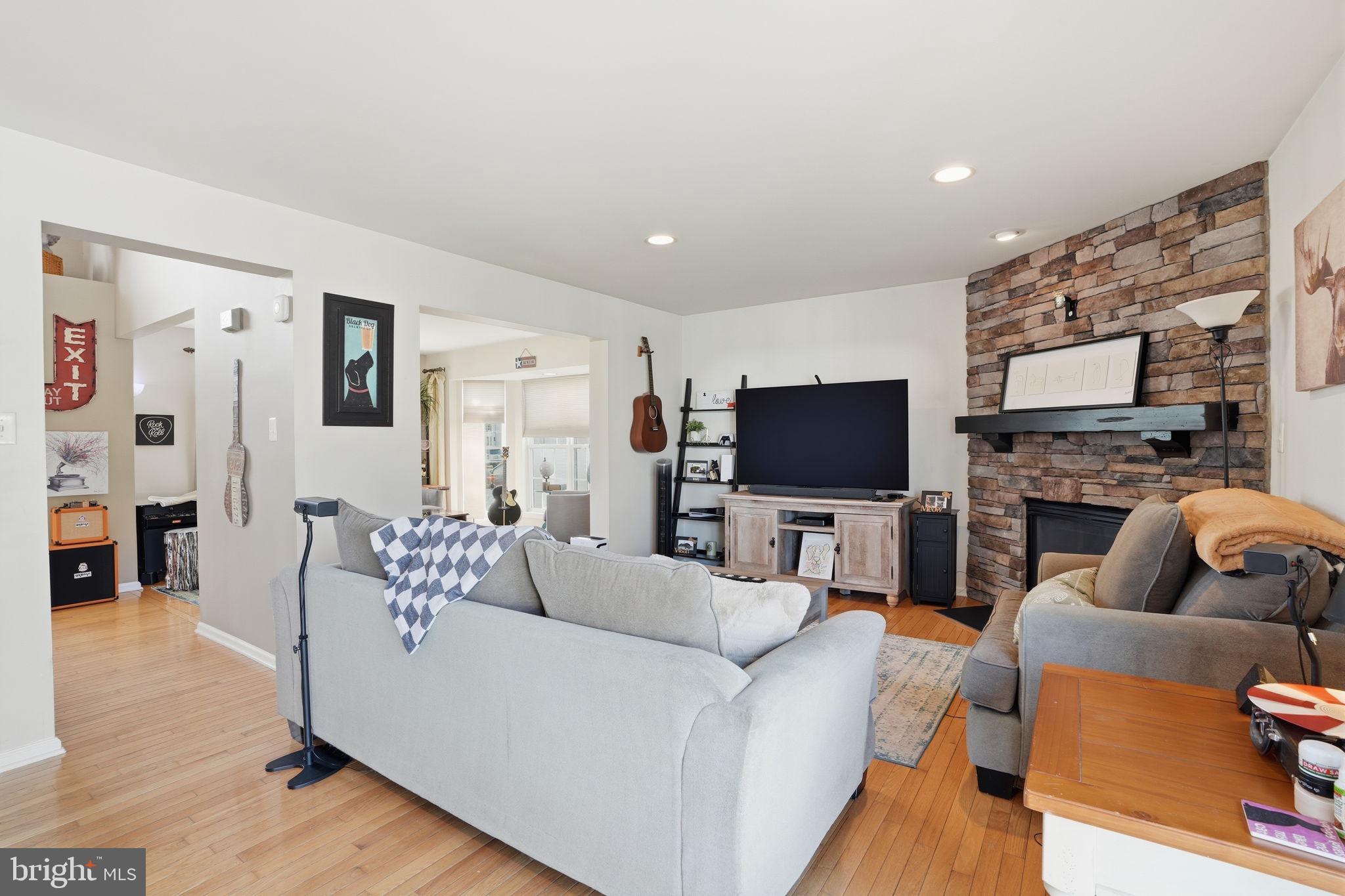 36 Moray Lane Sewell, NJ 08080 - Photo 2 of 40 a living room with furniture a flat screen tv and a fireplace