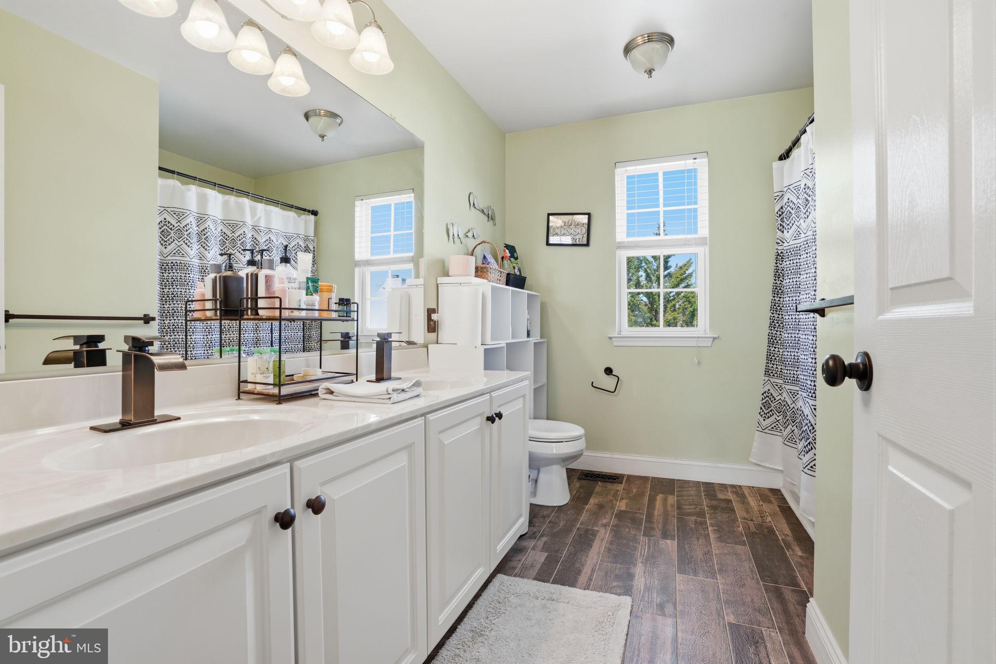 36 Moray Lane Sewell, NJ 08080 - Photo 24 of 40 a bathroom with a sink a mirror and a toilet