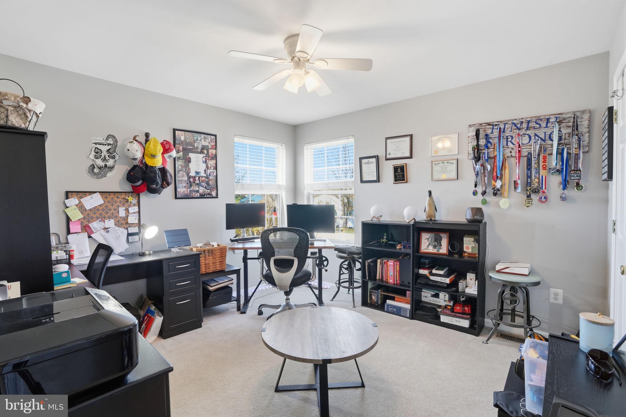 36 Moray Lane Sewell, NJ 08080 - Photo 25 of 40 a living room with furniture a desk and a bookshelf