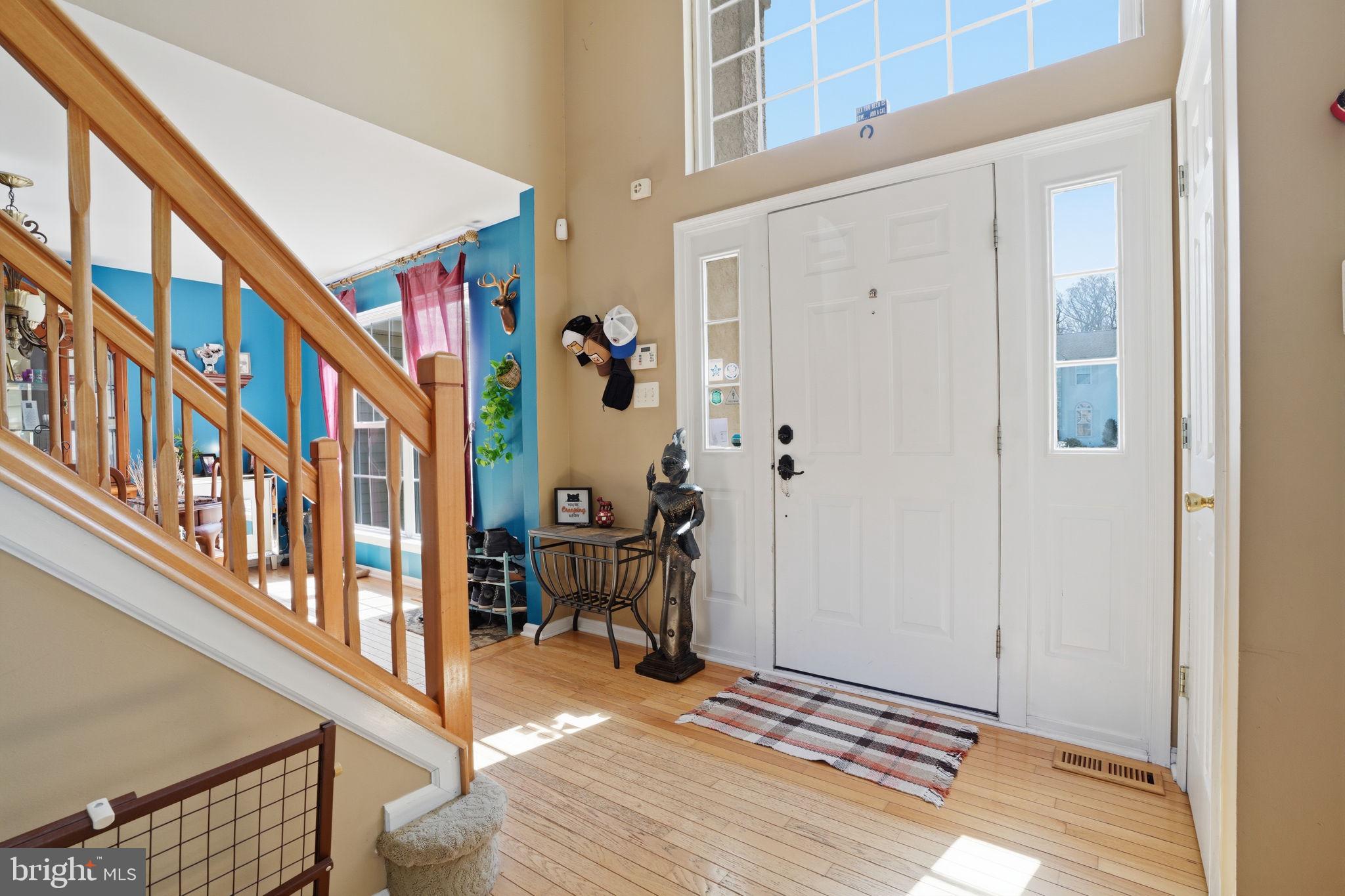 36 Moray Lane Sewell, NJ 08080 - Photo 26 of 40 a view of an entryway with wooden floor and stairs