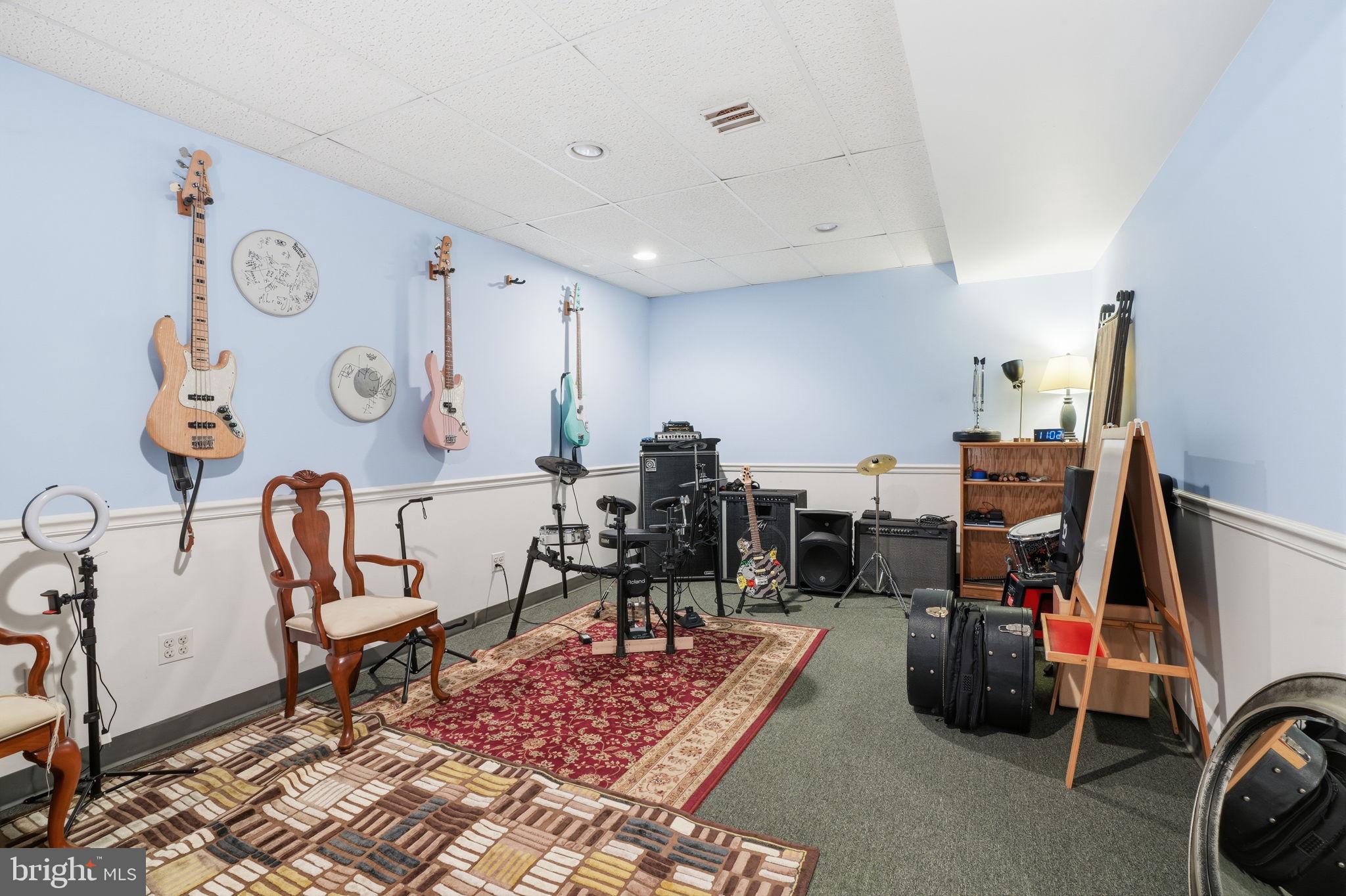 36 Moray Lane Sewell, NJ 08080 - Photo 37 of 40 a room with lots of white furniture a rug and a chair