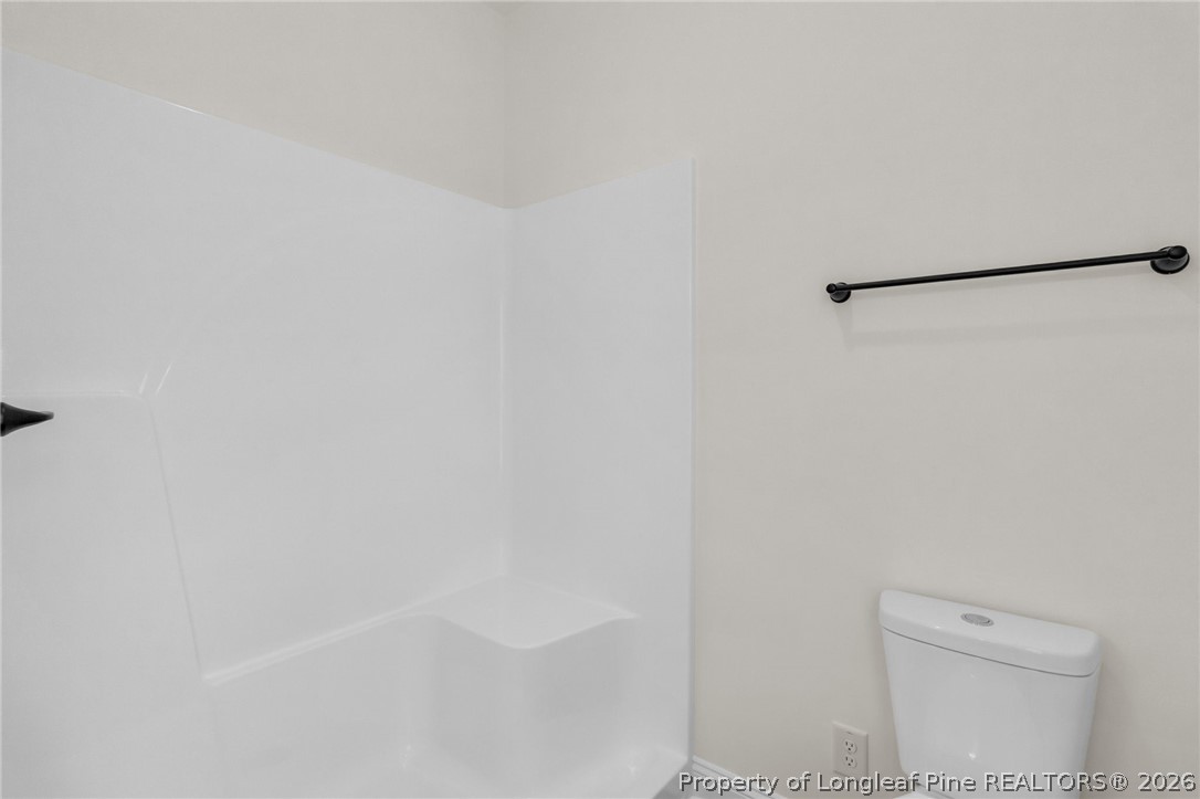 131 Merle Road Pinebluff, NC 28373 - Photo 21 of 33 a bathroom with a toilet and a shower