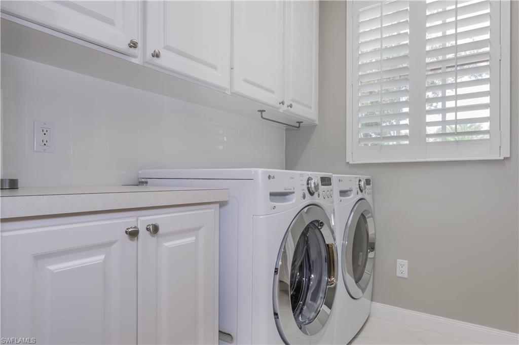 5441 Cove Circle Naples, FL 34119 - Photo 15 of 25 a utility room with dryer and washer