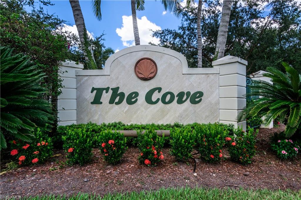 5441 Cove Circle Naples, FL 34119 - Photo 2 of 25 a sign that is on a brick wall