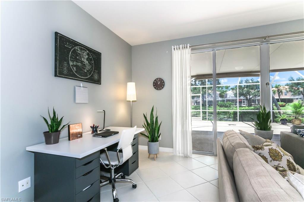 5441 Cove Circle Naples, FL 34119 - Photo 8 of 25 a living room with furniture potted plant and a large window