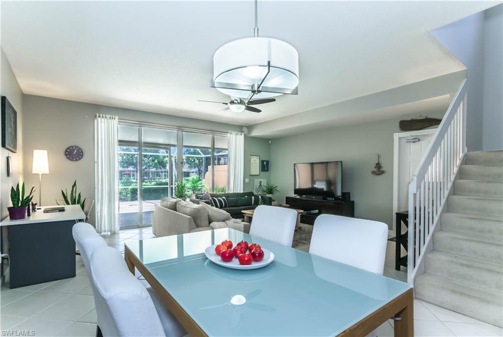 5441 Cove Circle Naples, FL 34119 - Photo 9 of 25 a living room with furniture and a table