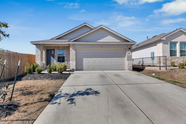 a front view of a house with yard