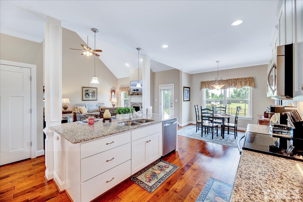 97 Baldwin Ridge Court Willow Spring, NC 27592 - Photo 14 of 46 a living room with furniture and a flat screen tv