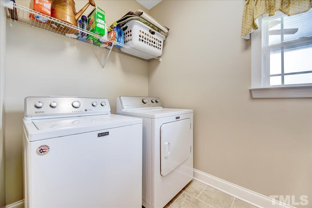 97 Baldwin Ridge Court Willow Spring, NC 27592 - Photo 20 of 46 a utility room with dryer and washer