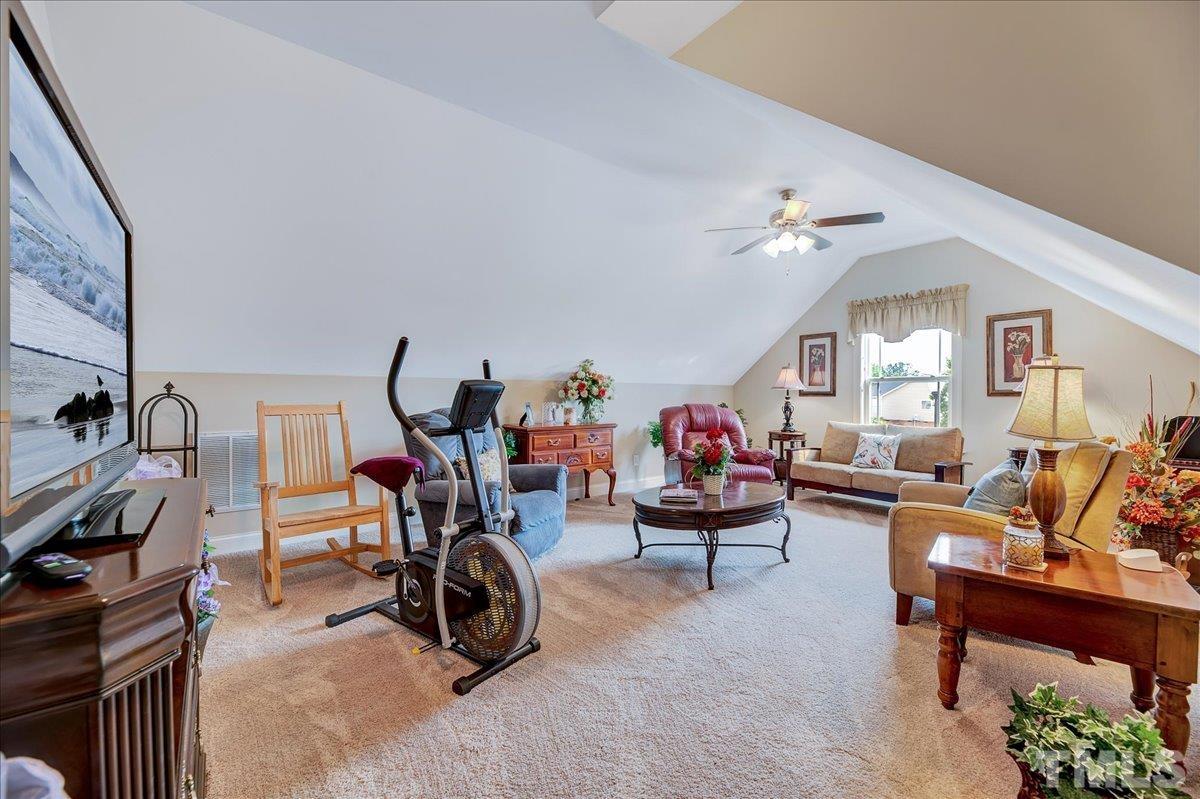 97 Baldwin Ridge Court Willow Spring, NC 27592 - Photo 30 of 46 a view of a room with gym equipment
