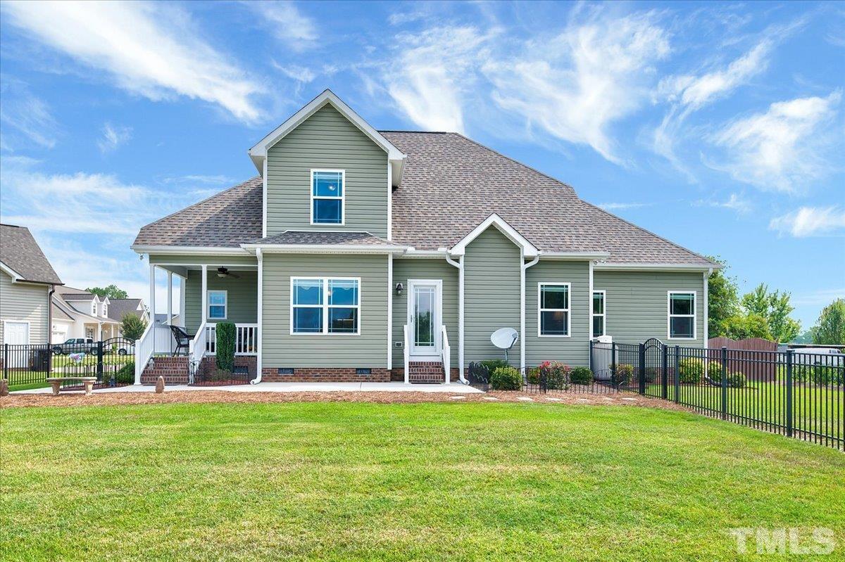 97 Baldwin Ridge Court Willow Spring, NC 27592 - Photo 35 of 46 a front view of house with yard and green space