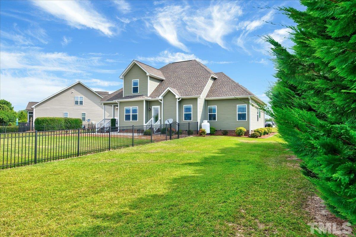 97 Baldwin Ridge Court Willow Spring, NC 27592 - Photo 37 of 46 a view of a house with a yard and porch