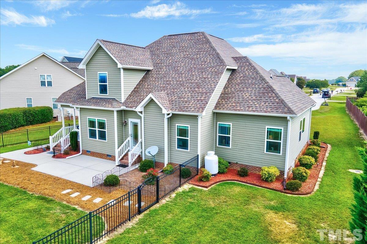 97 Baldwin Ridge Court Willow Spring, NC 27592 - Photo 38 of 46 a front view of house with yard and outdoor seating