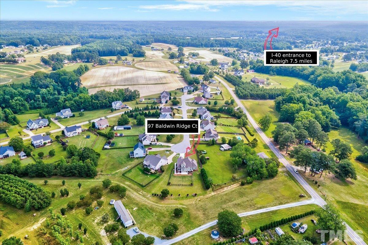 97 Baldwin Ridge Court Willow Spring, NC 27592 - Photo 41 of 46 an aerial view of residential houses with outdoor space and seating area