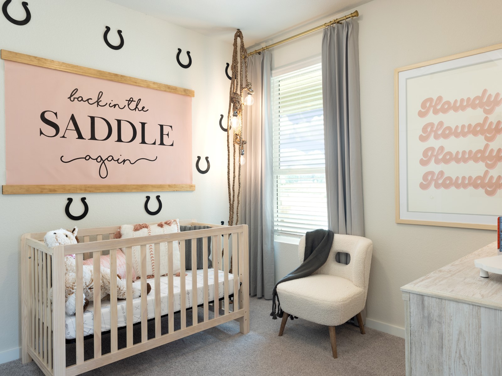 14316 Grey Pointe Court Conroe, TX 77302 - Photo 6 of 9 a bedroom with a baby bed a couch and a window