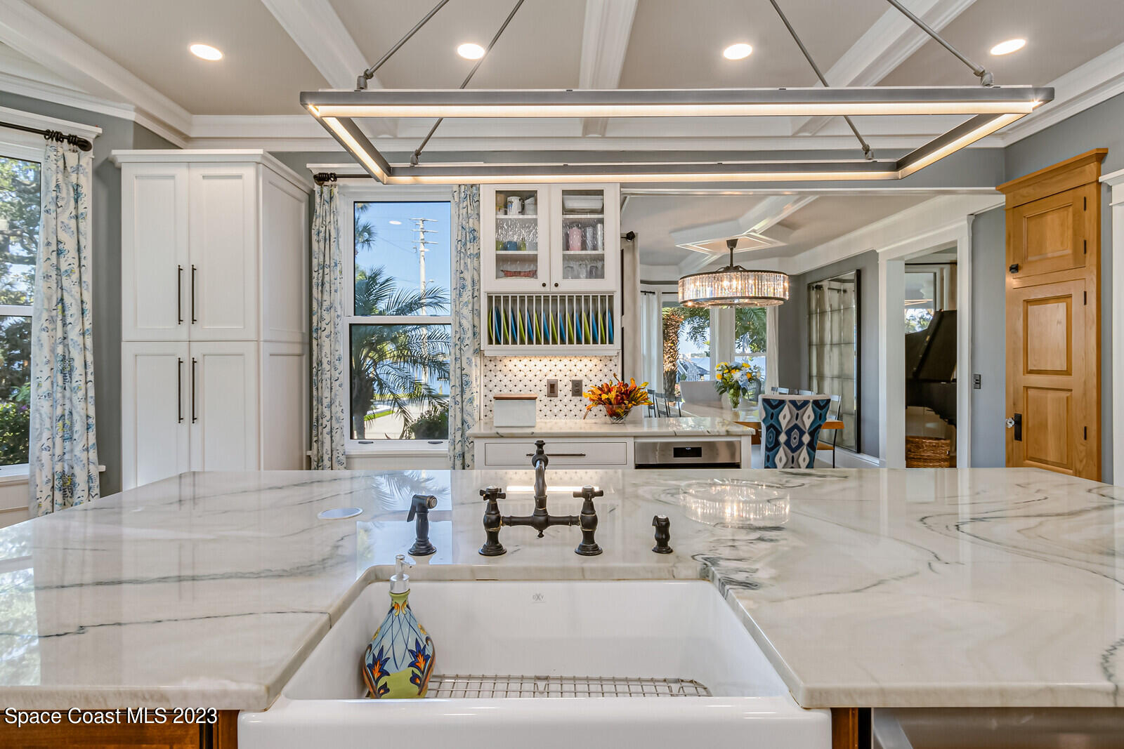 709 Rockledge Drive Rockledge, FL 32955 - Photo 20 of 102 a large white building with glass windows and painted walls