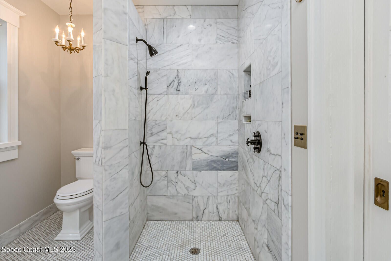 709 Rockledge Drive Rockledge, FL 32955 - Photo 43 of 102 a bathroom with a shower toilet and sink