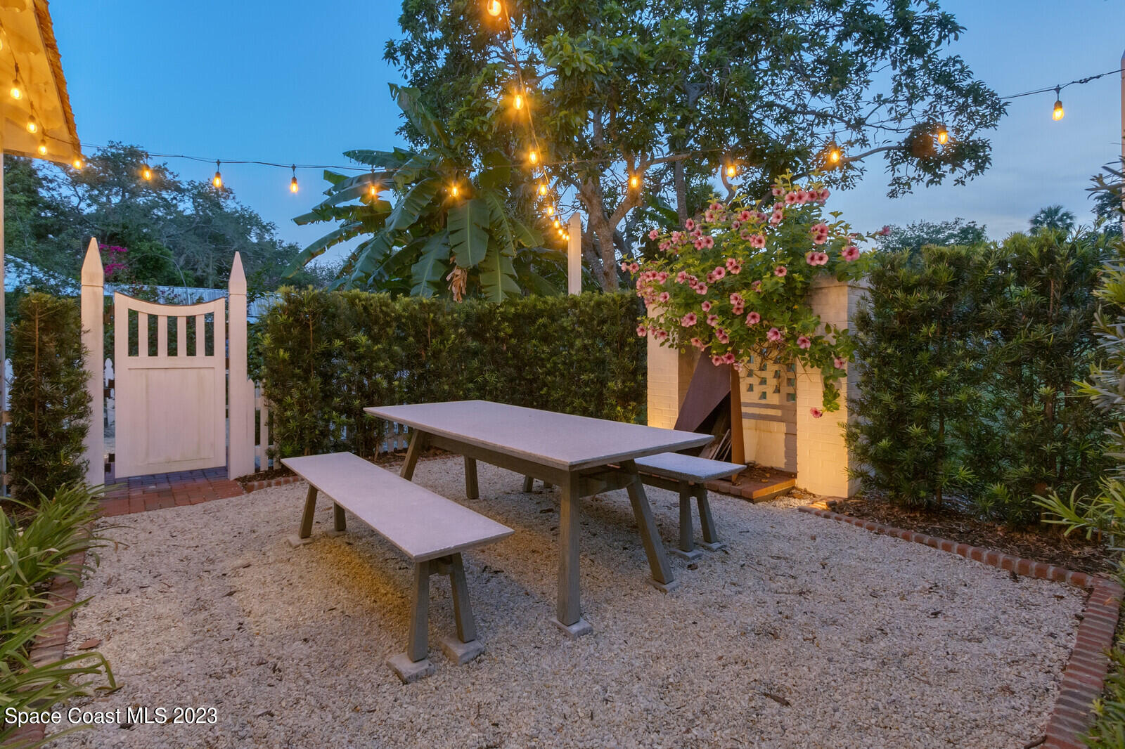 709 Rockledge Drive Rockledge, FL 32955 - Photo 68 of 102 a view of a chairs and table in the backyard