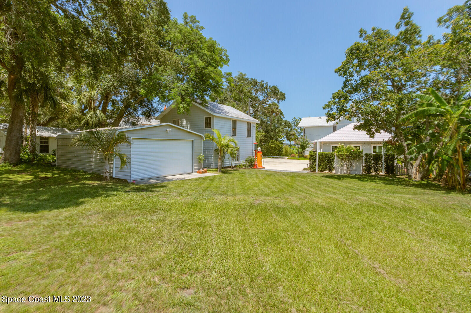 709 Rockledge Drive Rockledge, FL 32955 - Photo 95 of 102 a front view of a house with a garden
