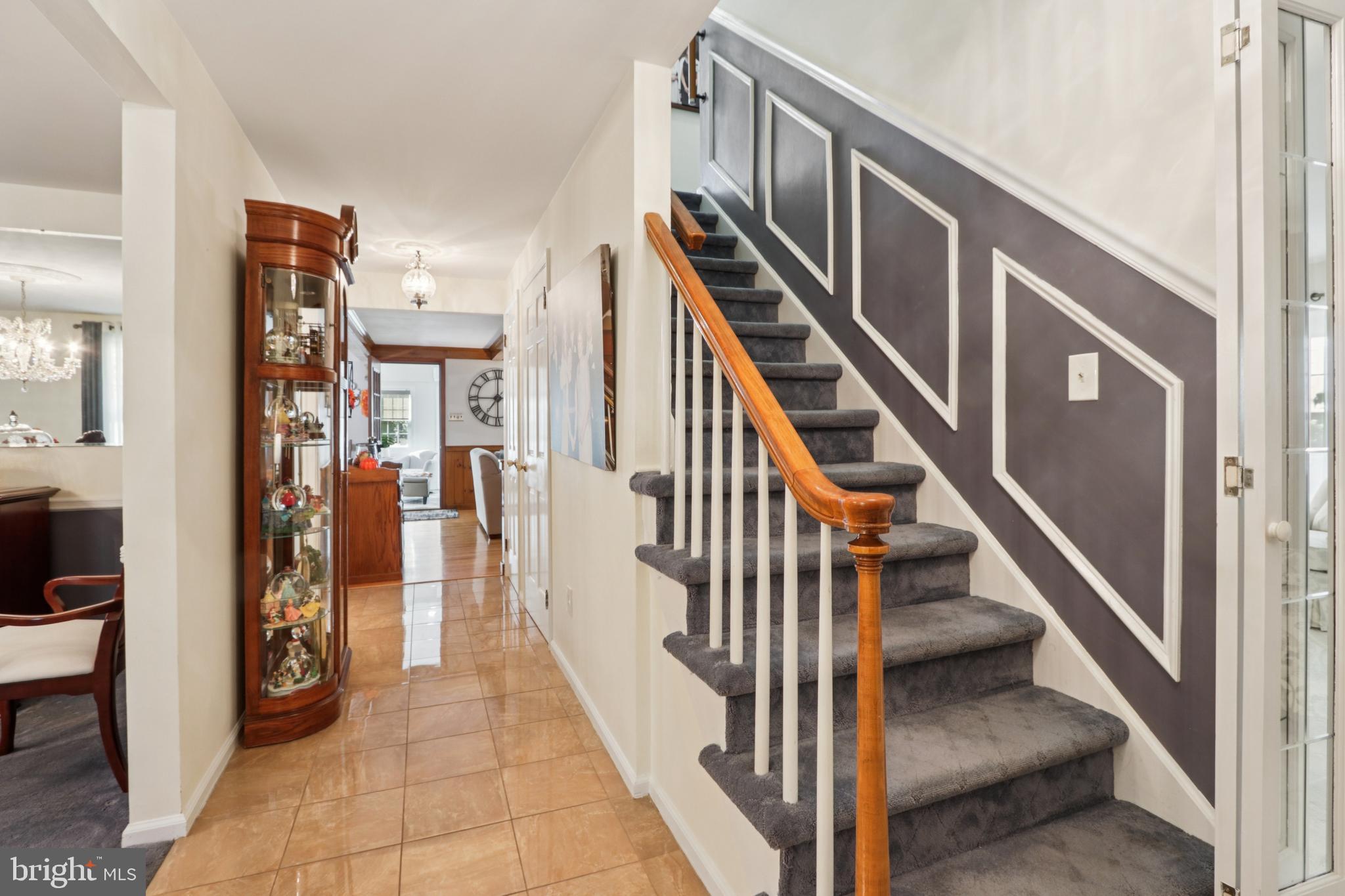 102 Partree Road Cherry Hill, NJ 08003 - Photo 19 of 87 a view of staircase with lots of frames on wall and a window