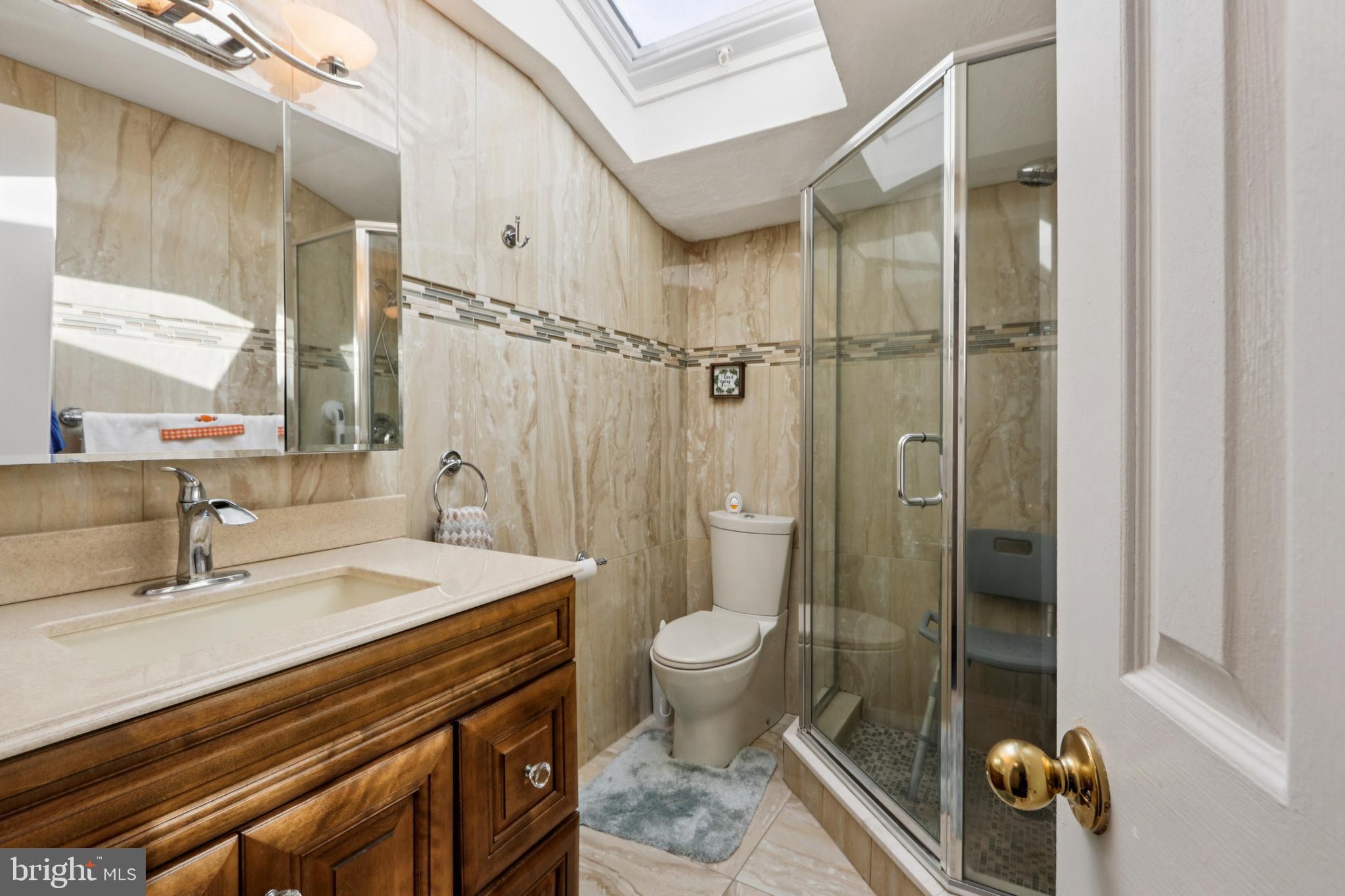 102 Partree Road Cherry Hill, NJ 08003 - Photo 48 of 87 a bathroom with a sink a toilet a mirror and shower