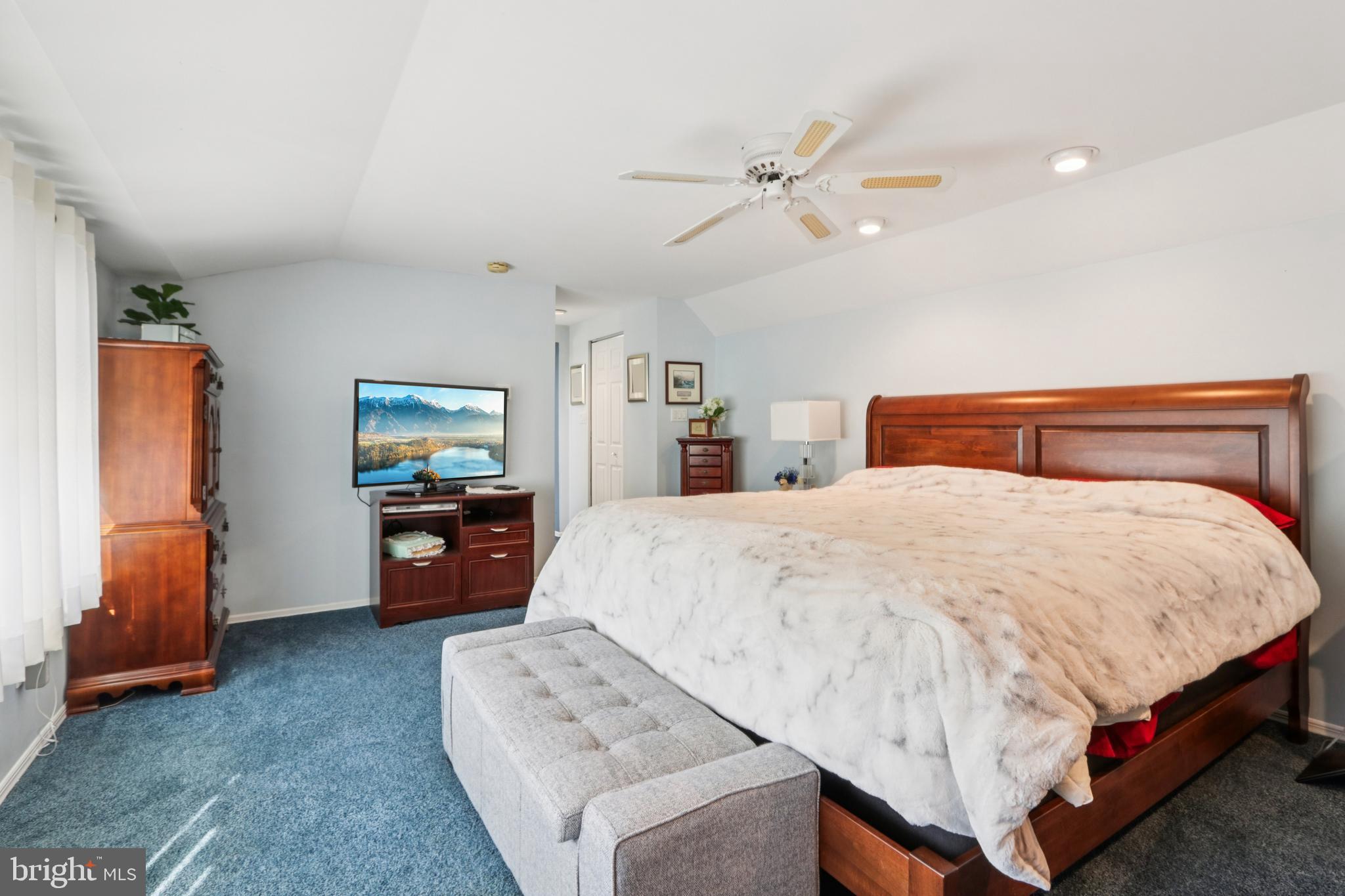 102 Partree Road Cherry Hill, NJ 08003 - Photo 51 of 87 a bedroom with a bed and a chandelier